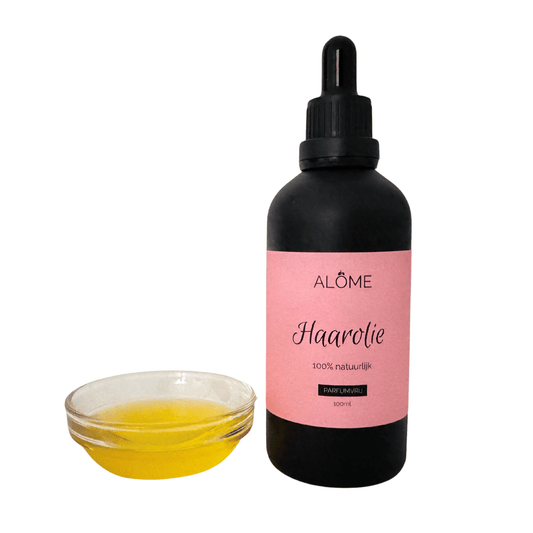 Haarolie in zwart pipetflesje en glazen schaaltje